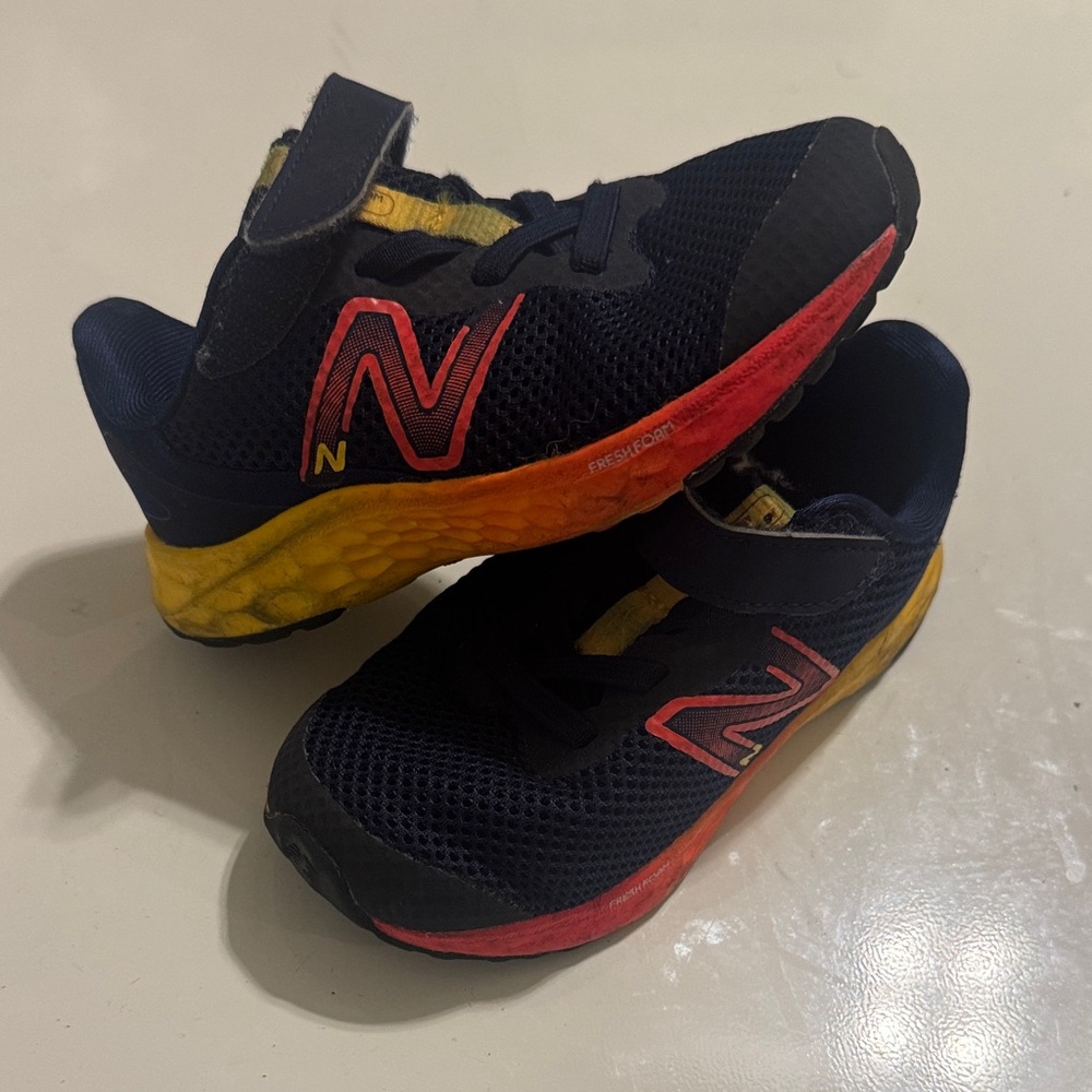 New Balance Kids Navy Sneakers with Yellow-to-Red Gradient Midsole Toddler 8